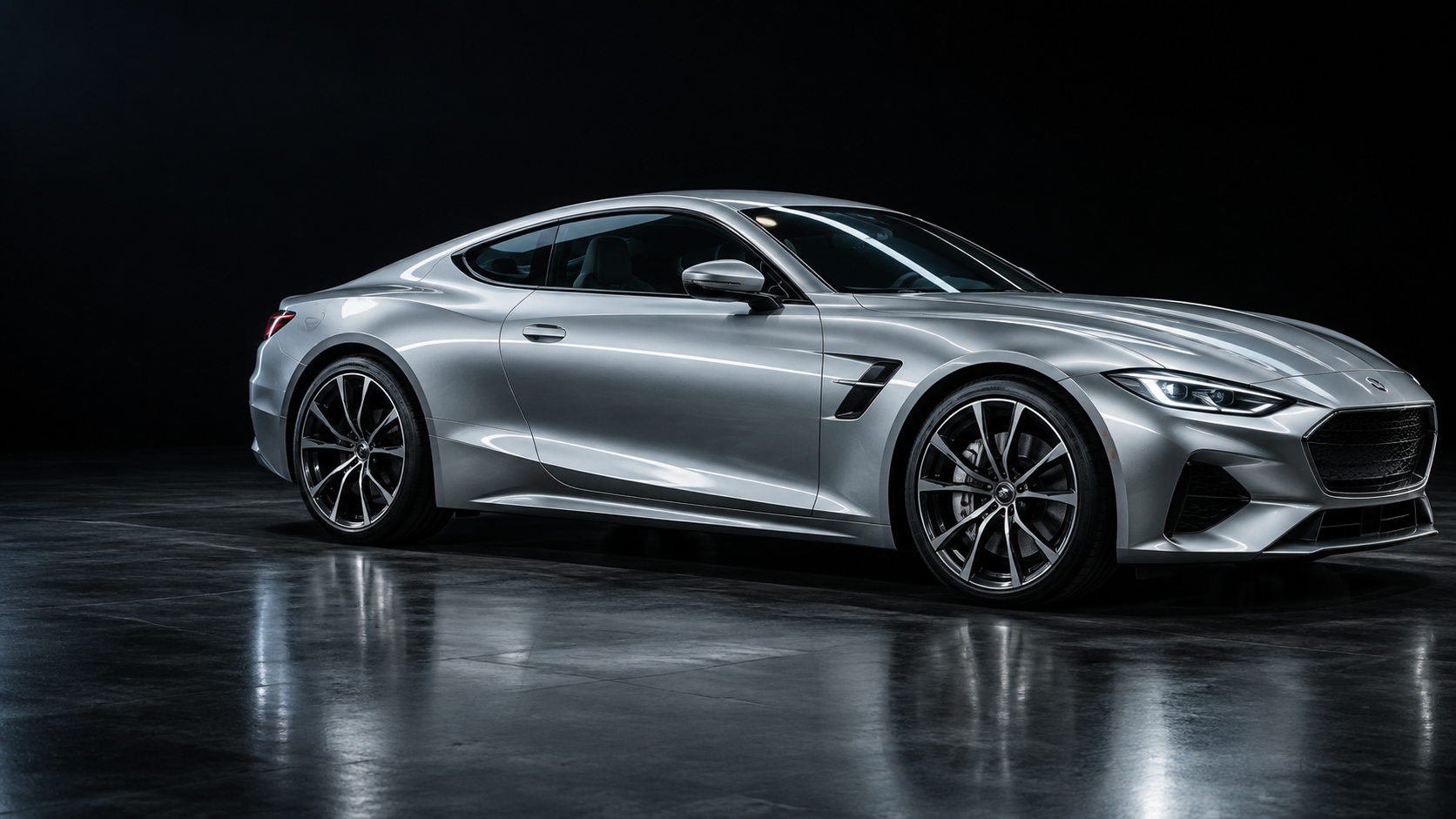 Sculpted silver coupe with crisp light reflected along its body lines